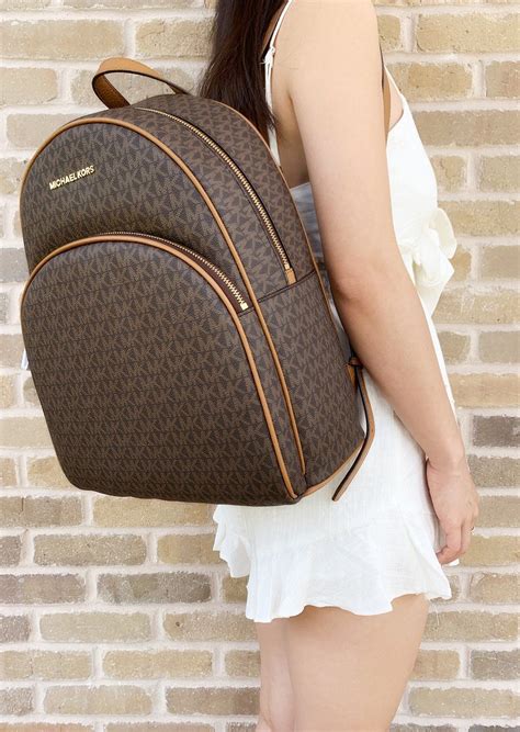 gold and brown michael kors bag|Michael Kors brown leather backpack.